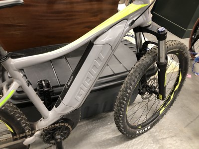 Lot 1390 - A Fathom Giant electric bicycle and charger.