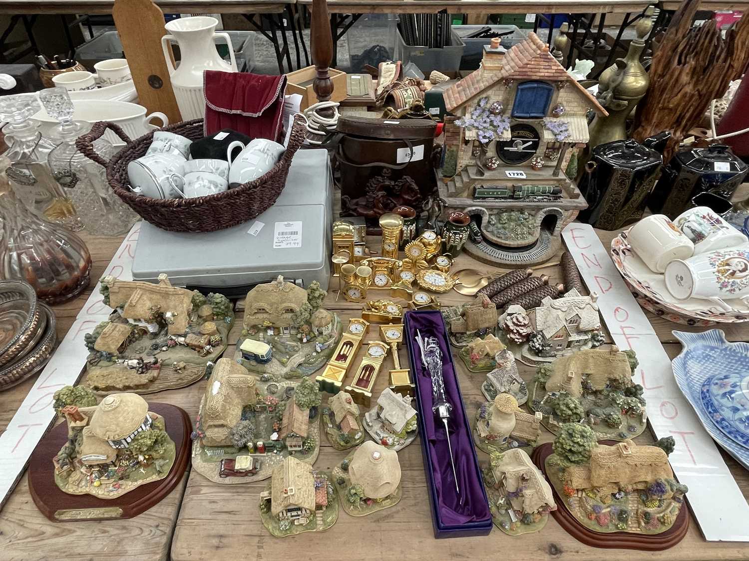 Lot 1728 - Lilliput Lane cottages, novelty clocks in gilt...