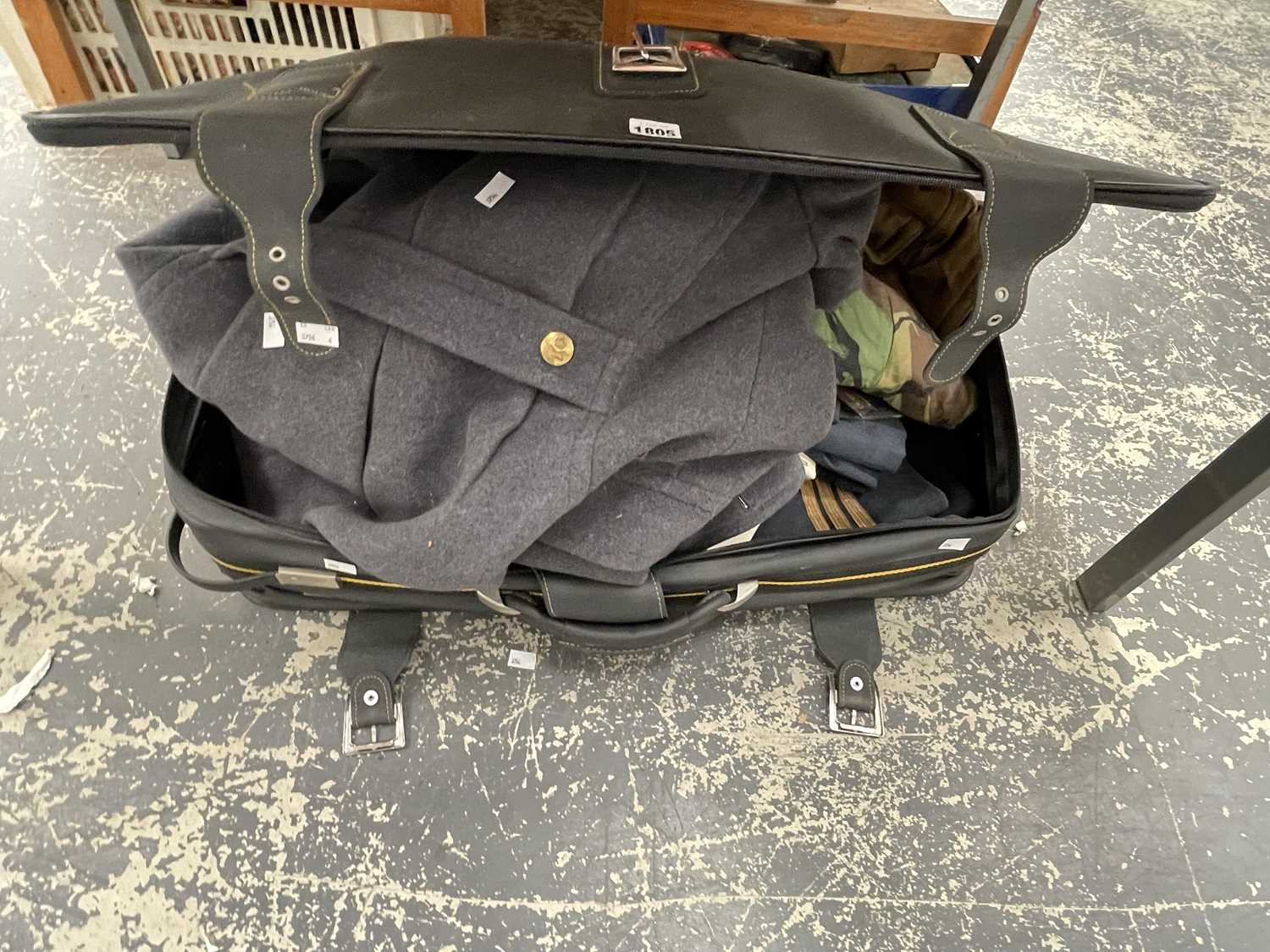 Lot 1805 - A suitcase containing a RAF great coat,...