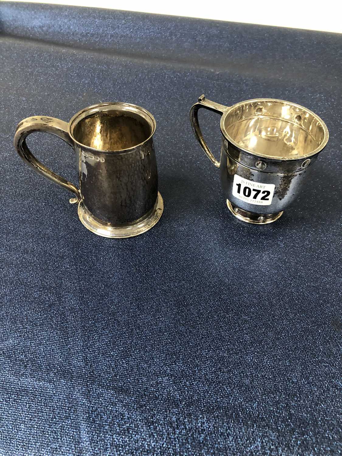 Lot 1072 - Two hallmarked silver small tankards. Gross...