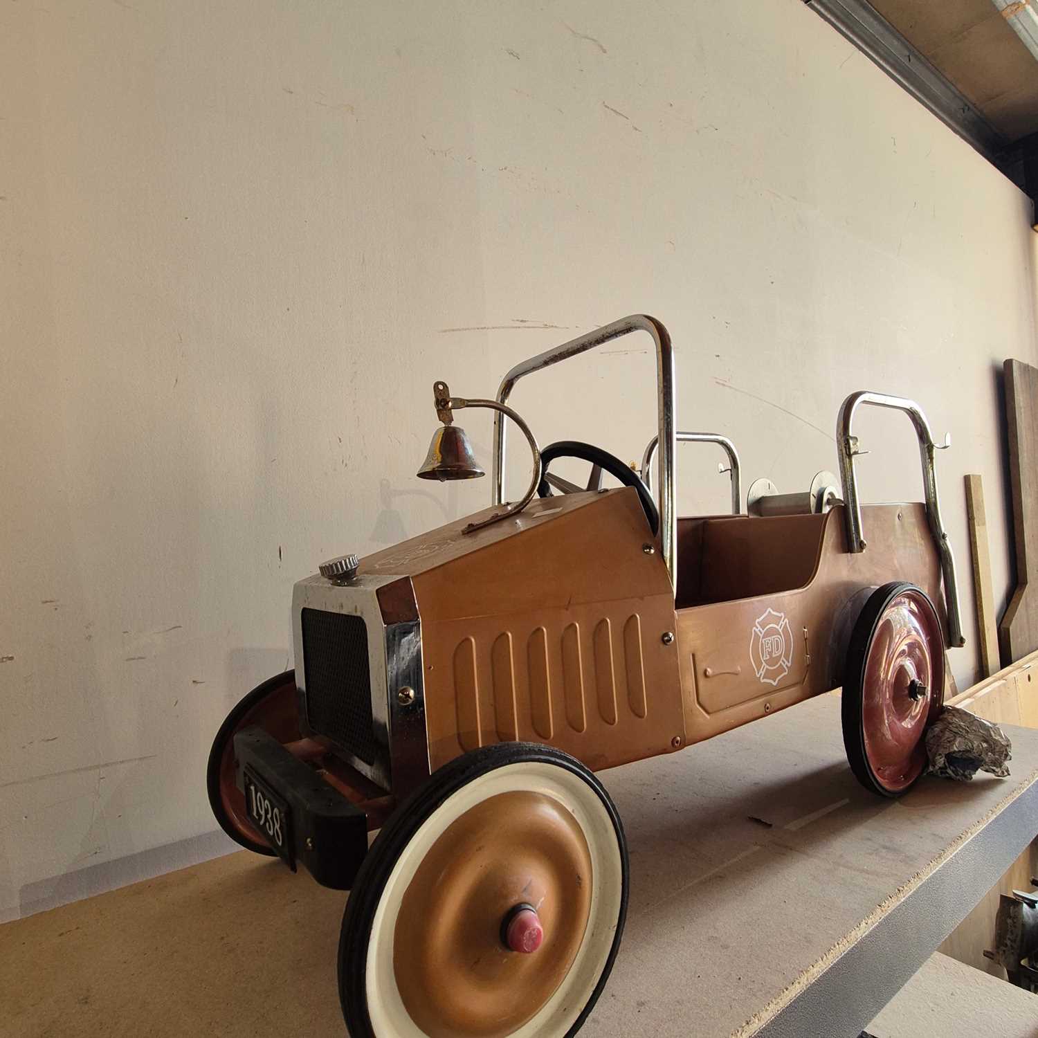 Lot 1398 - Vintage style Tin Plate pedal car in the form...