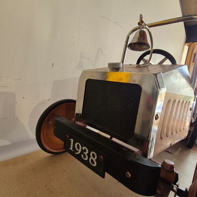 Lot 1398 - Vintage style Tin Plate pedal car in the form...