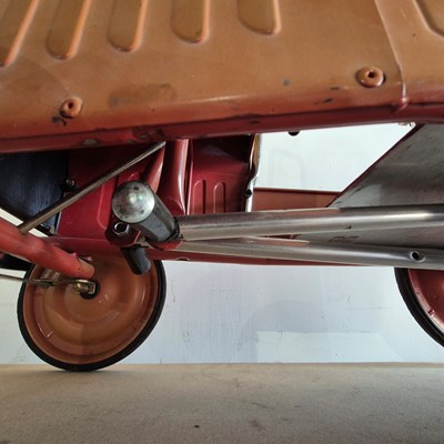 Lot 1398 - Vintage style Tin Plate pedal car in the form...