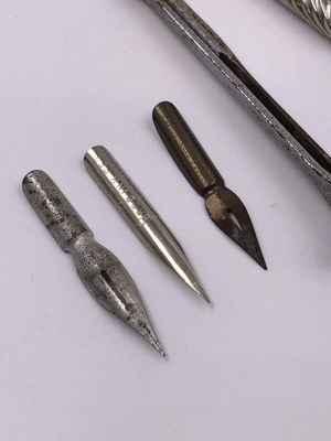 Lot 1021 - A continental silver propelling pencil, two...