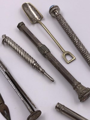 Lot 1021 - A continental silver propelling pencil, two...