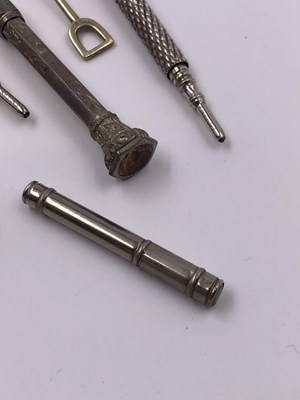 Lot 1021 - A continental silver propelling pencil, two...