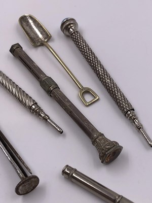 Lot 1021 - A continental silver propelling pencil, two...