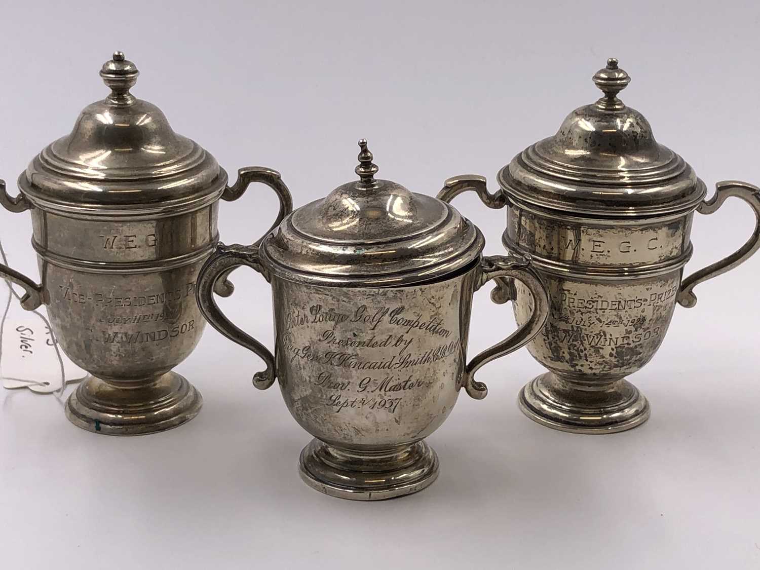 Lot 1057 - Three hallmarked silver presentation trophy...