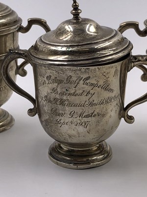 Lot 1057 - Three hallmarked silver presentation trophy...