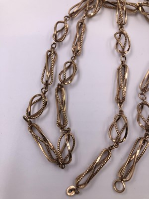Lot 1011 - A 9ct hallmarked gold fancy link open-work...