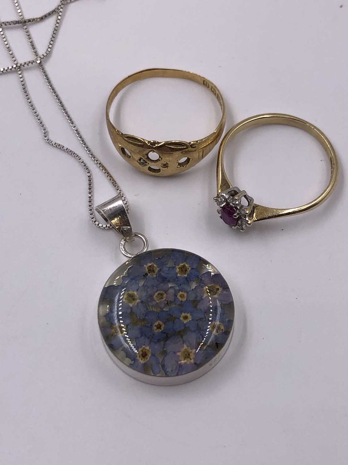 Lot 1016 - A 9ct, hallmarked gold ruby and diamond...