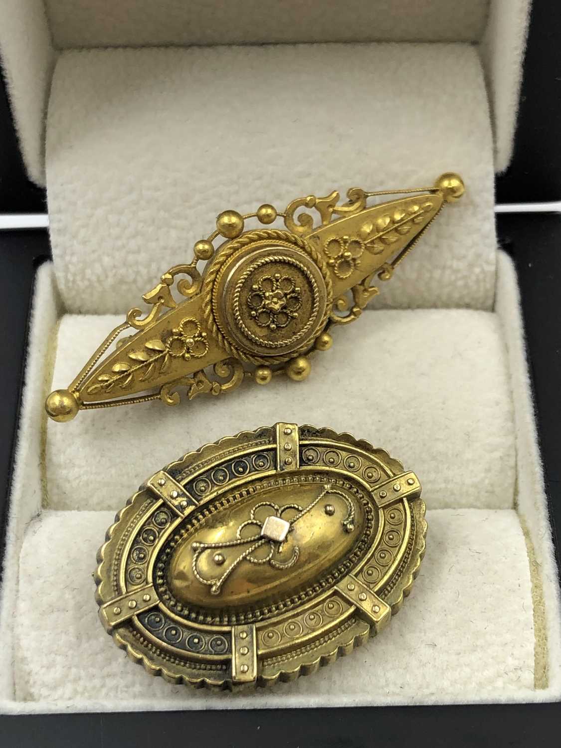 Lot 1018 - Two antique 15ct  stamped brooches, one with a...
