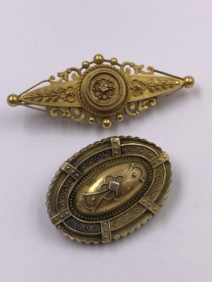 Lot 1018 - Two antique 15ct  stamped brooches, one with a...