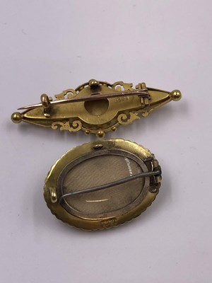 Lot 1018 - Two antique 15ct  stamped brooches, one with a...