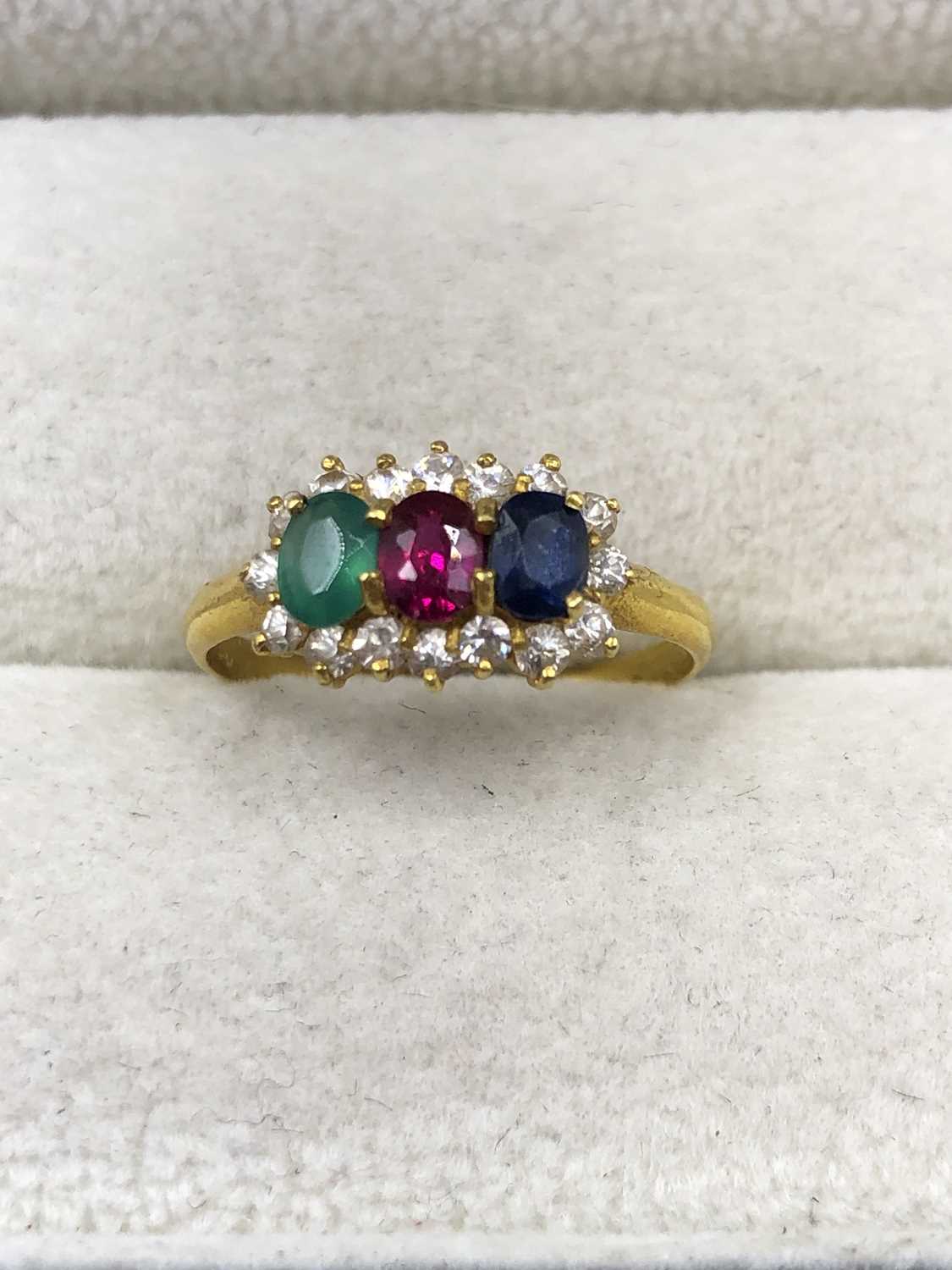 Lot 1031 - An unhallmarked gemset cluster ring, testing...