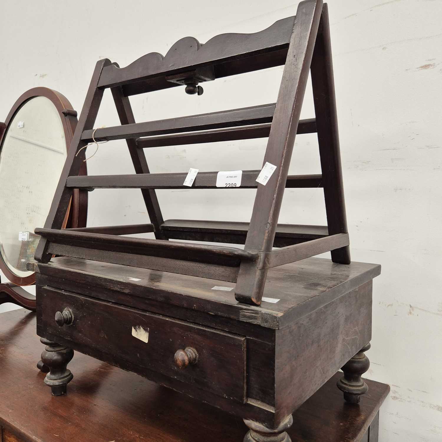 Lot 2209 - An antique reading stand together with a low...