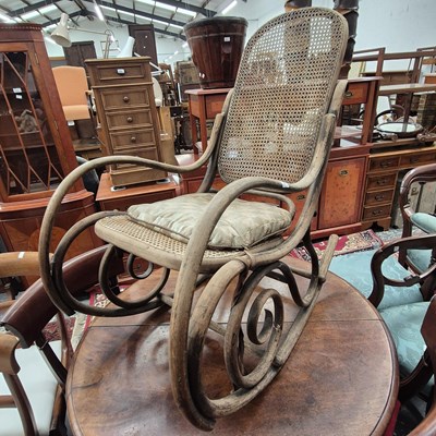 Lot 2231 - An antique Bentwood framed rocking chair with...
