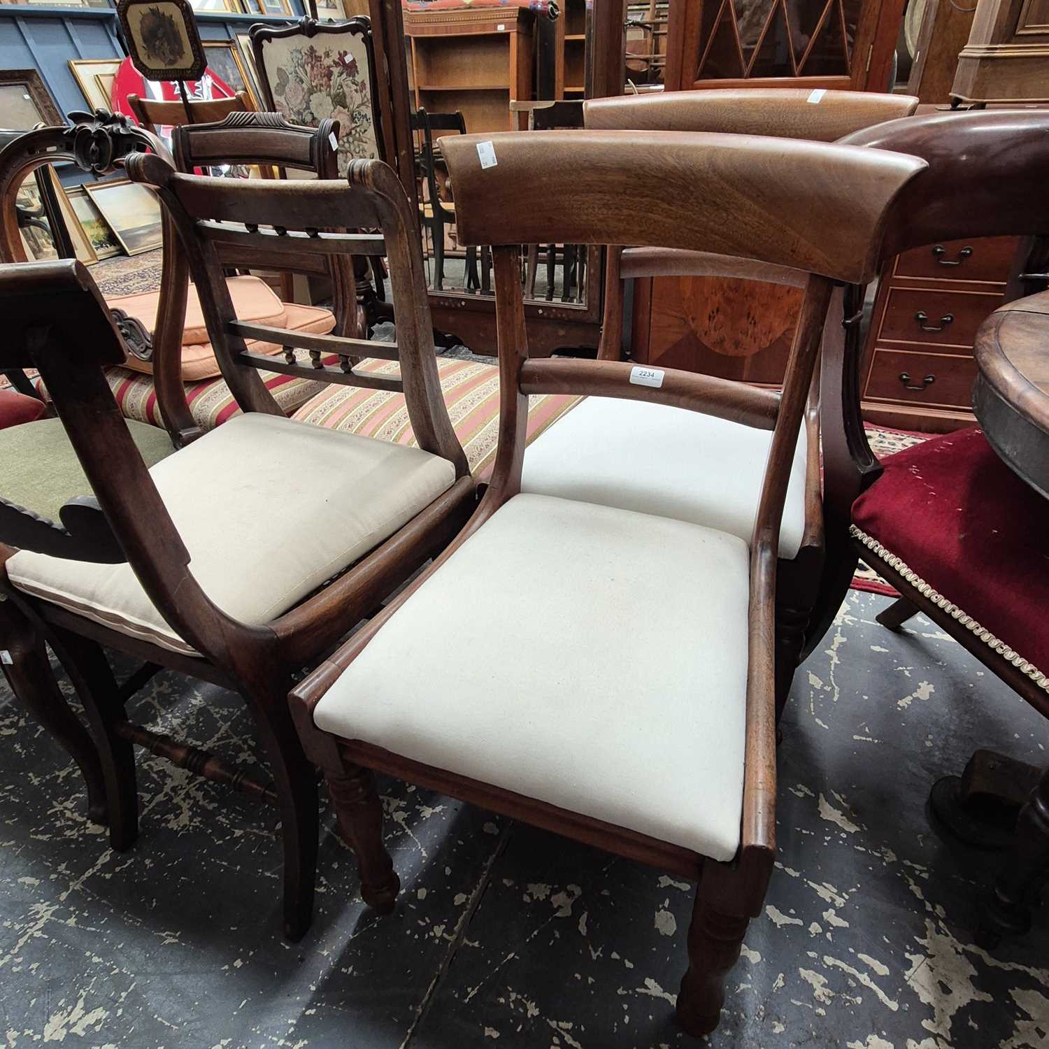 Lot 2234 - A pair of regency ebonised cane seated side...