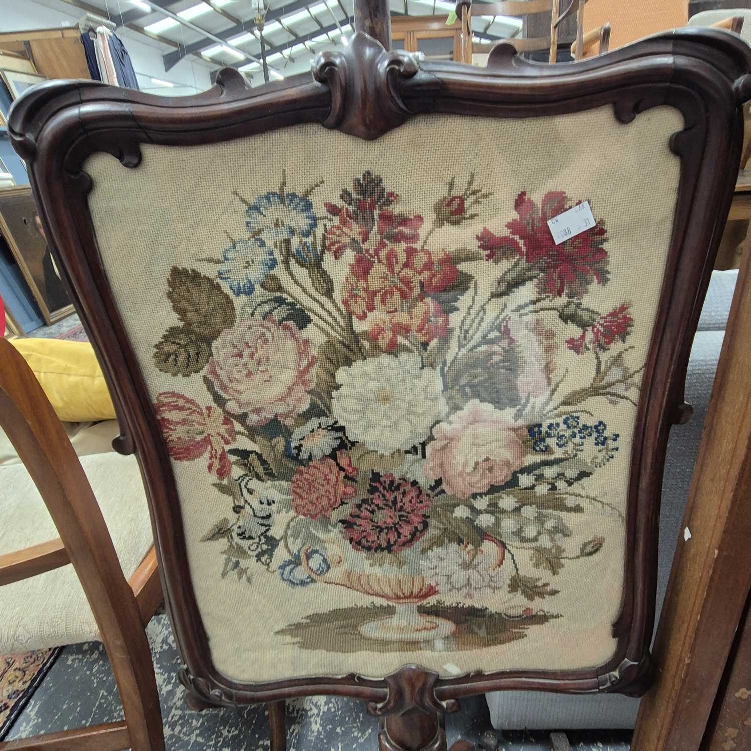 Lot 2237 - A Victorian mahogany pole screen, the...