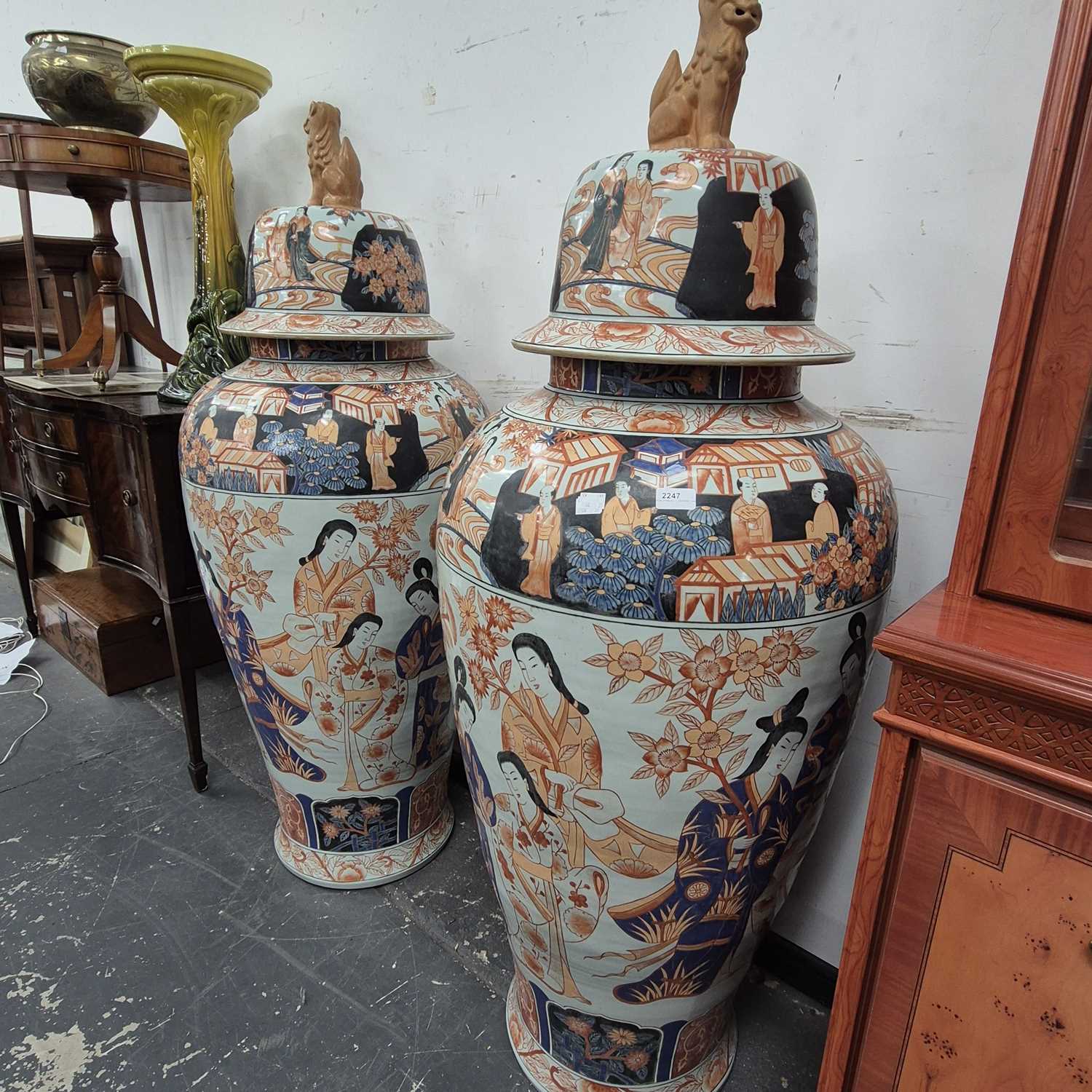 Lot 2247 - A pair of monumental Imari decorated lidded...