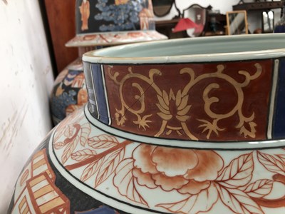 Lot 2247 - A pair of monumental Imari decorated lidded...