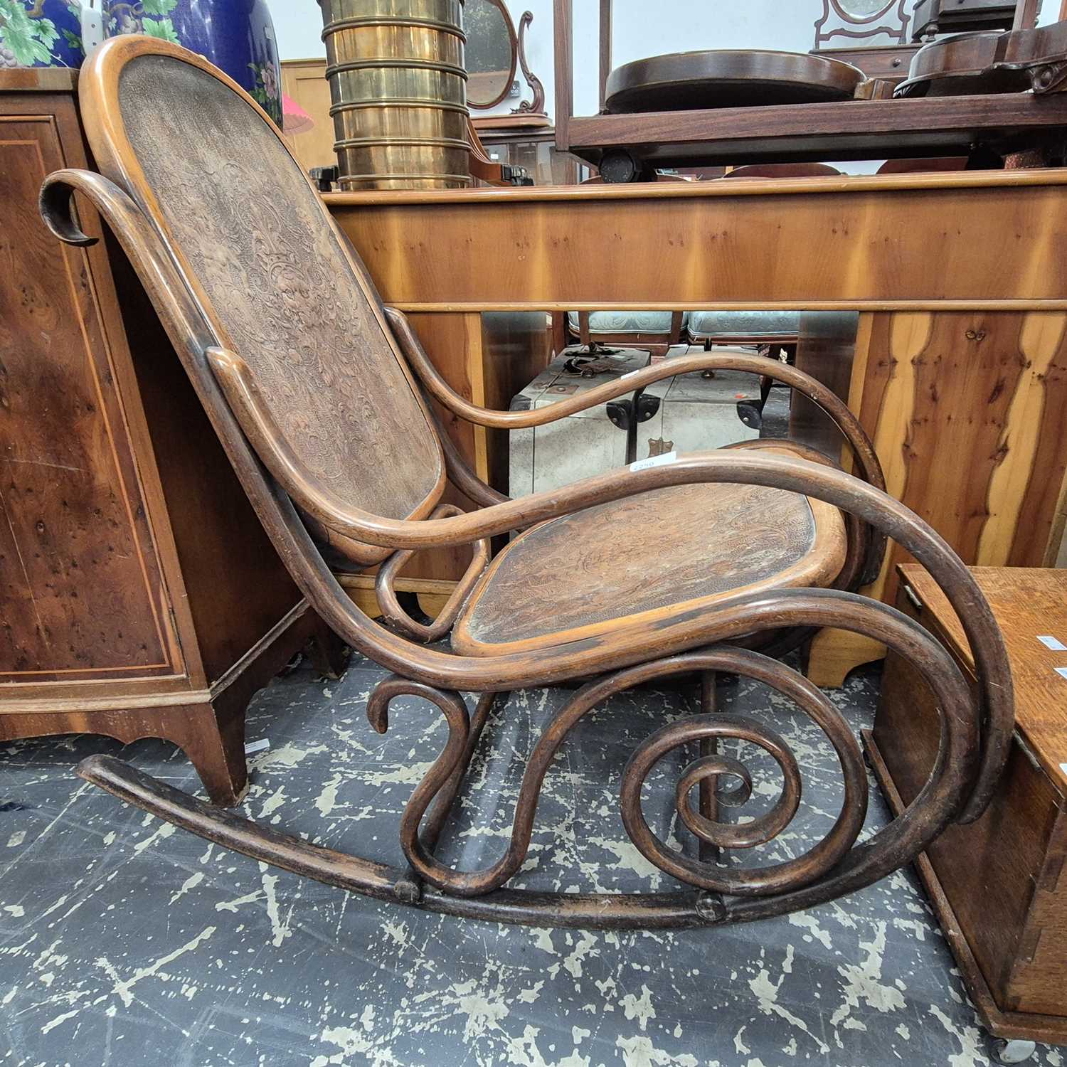 Lot 2250 - An antique bentwood rocking chair, probably