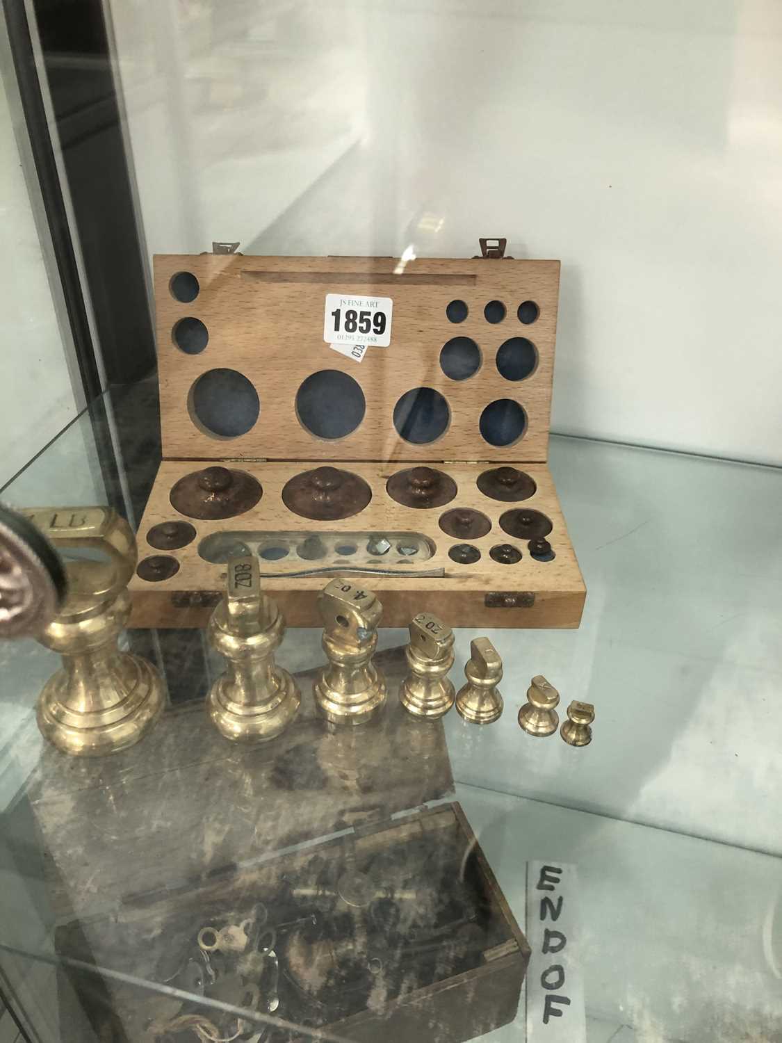 Lot 1859 - A boxed set of copper gram weights together...