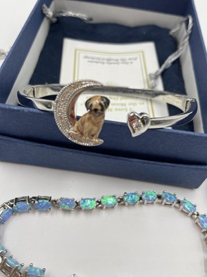 Lot 1060 - A Bradford Exchange "I love my pug" bangle,...