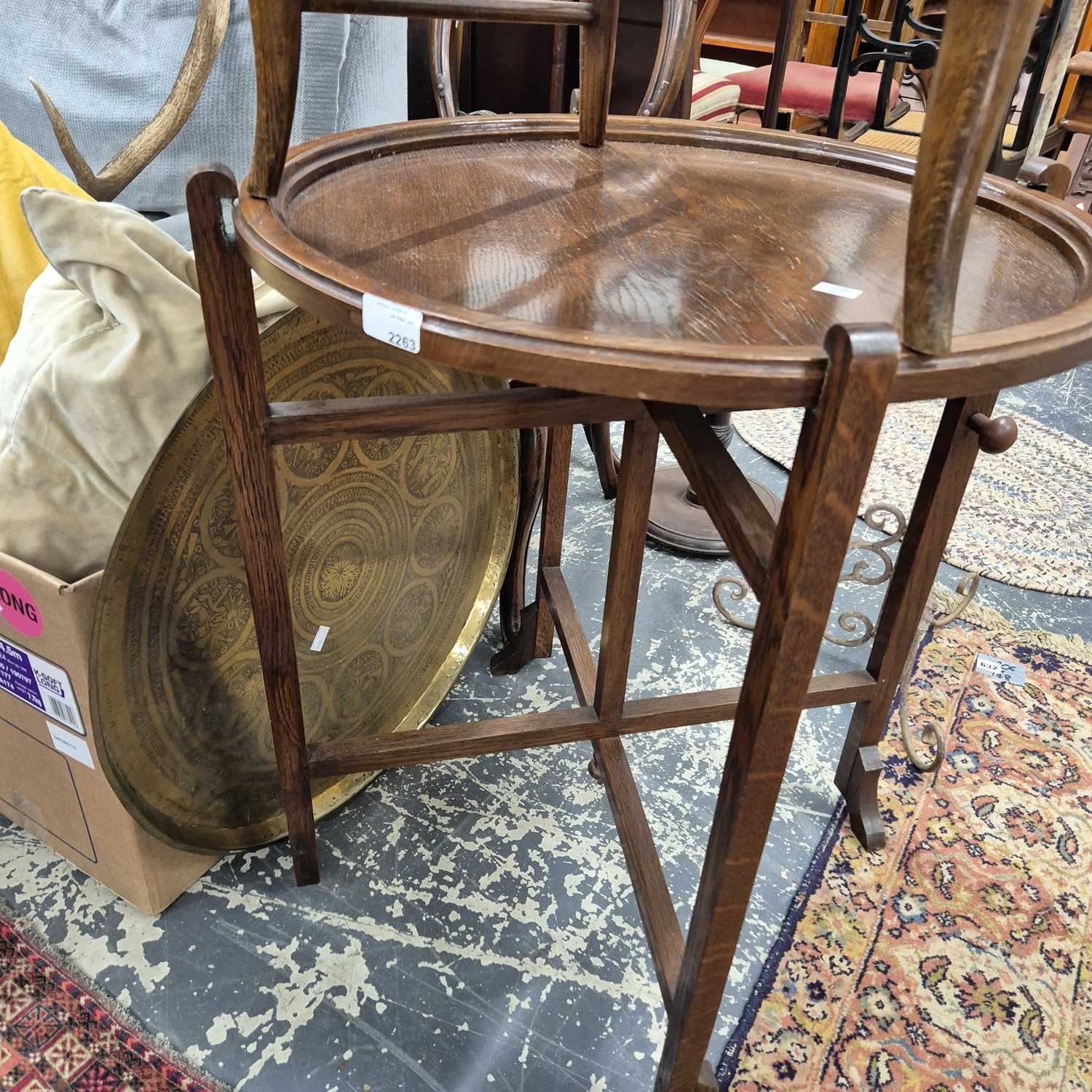 Lot 2263 - An oak foldaway occasional table and an...