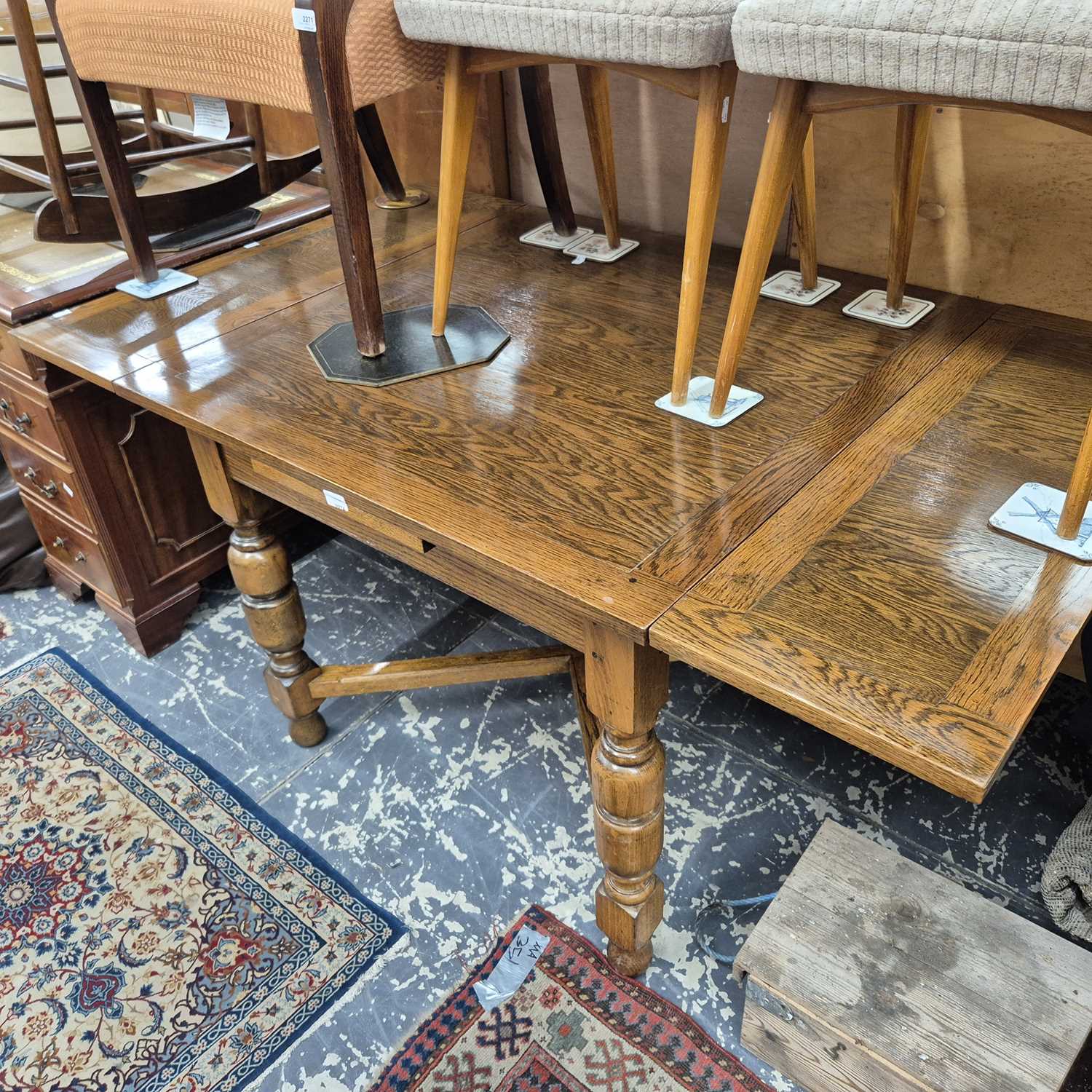 Lot 2274 - An oak drawer leaf table.