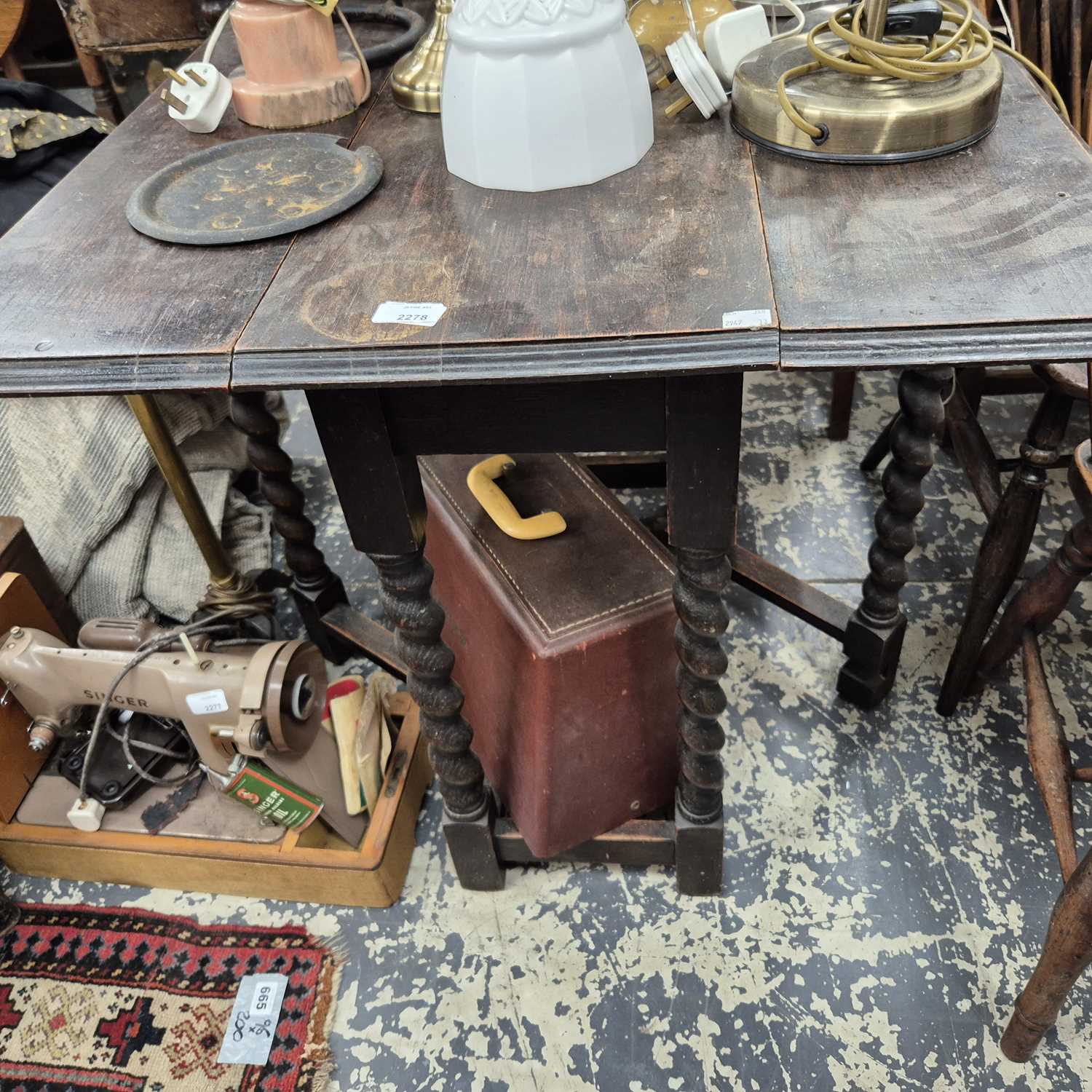 Lot 2278 - A small oak gate leg table.