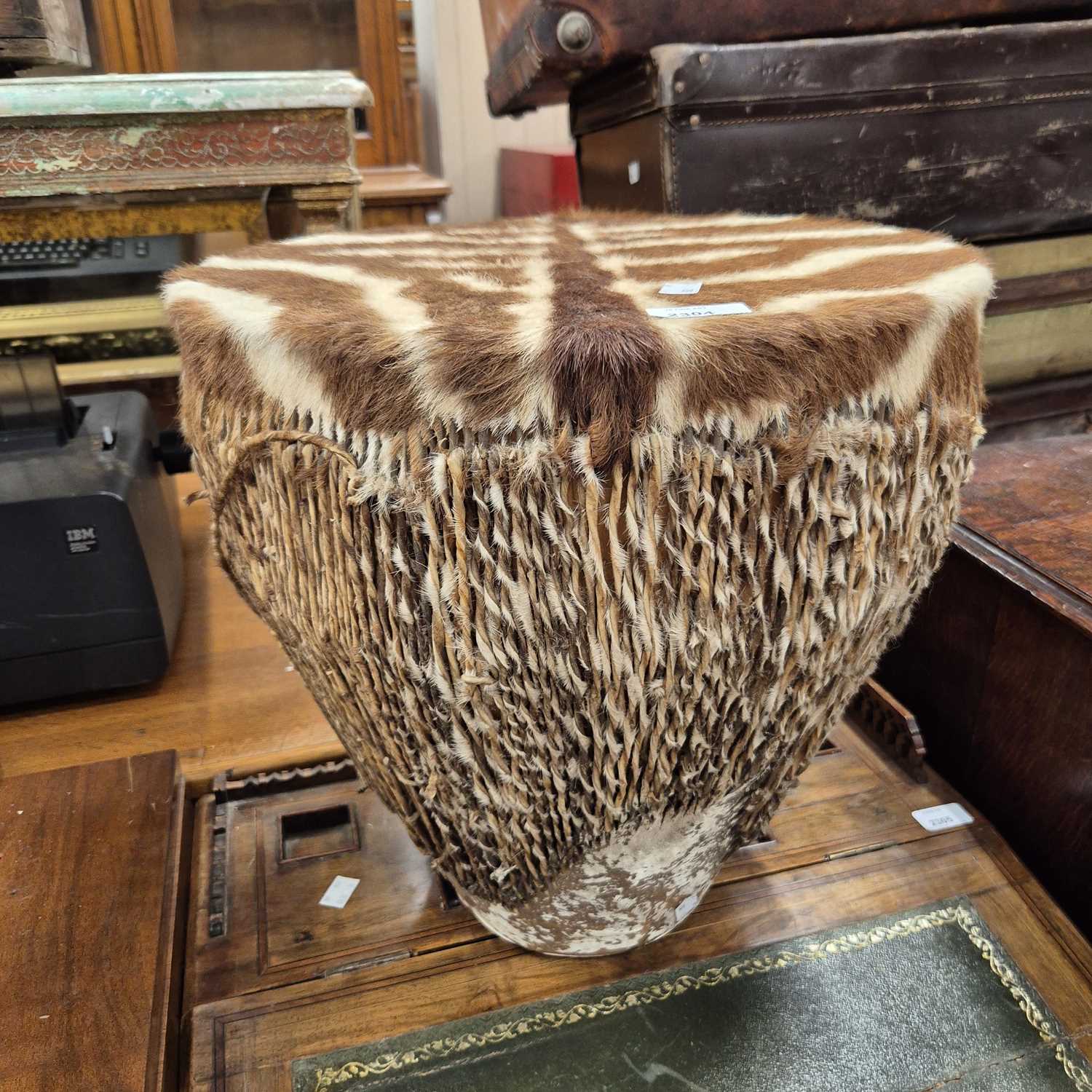 Lot 2304 - An African zebra hide drum.