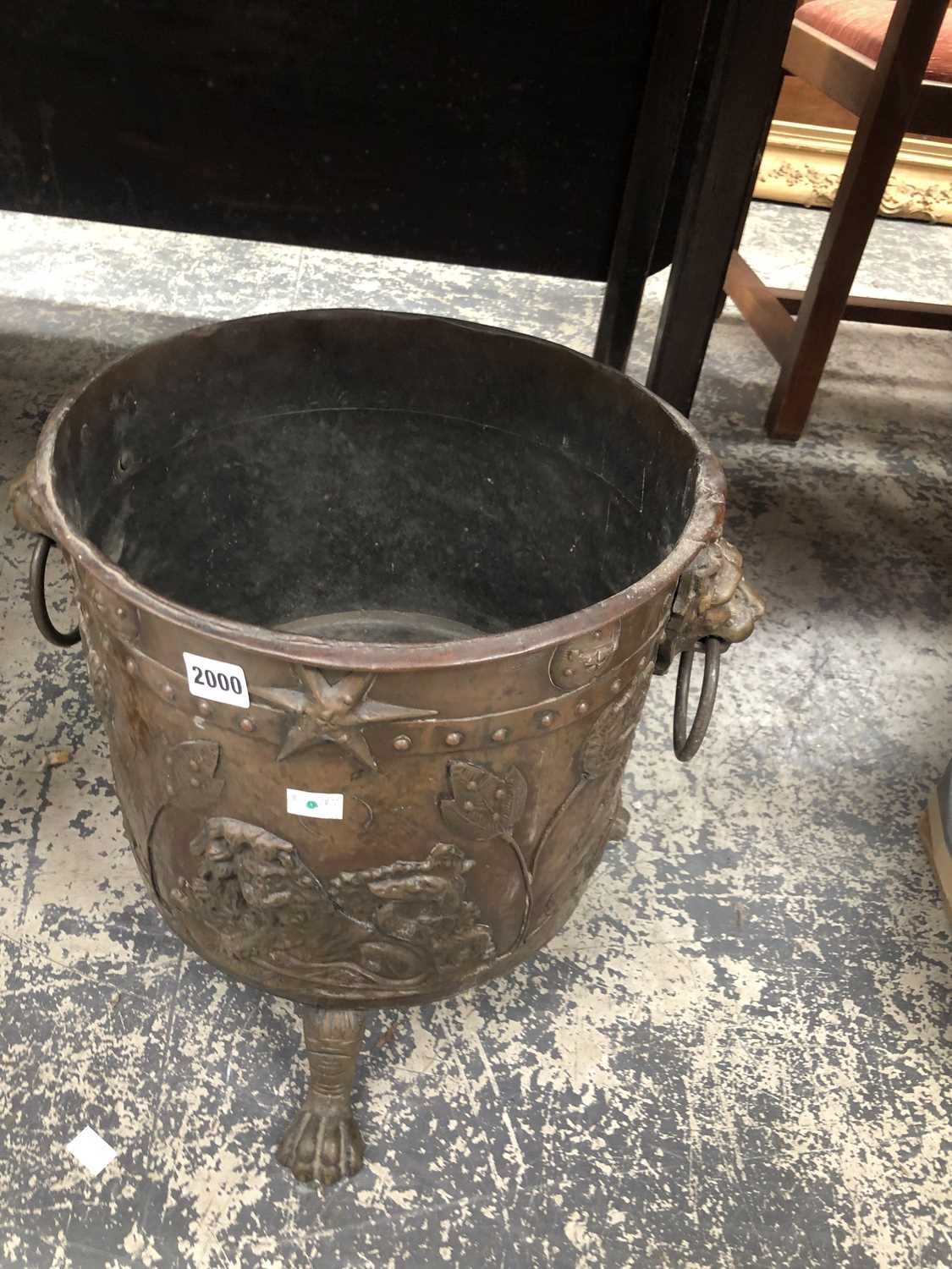 Lot 2000 - A copper lion mask and ring handled coal...
