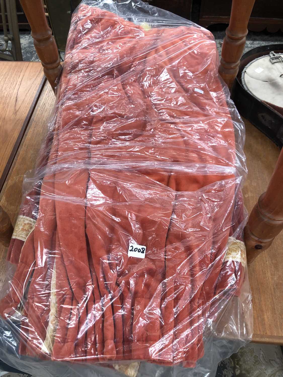 Lot 2008 - A pair of rust red velvet interlined curtains