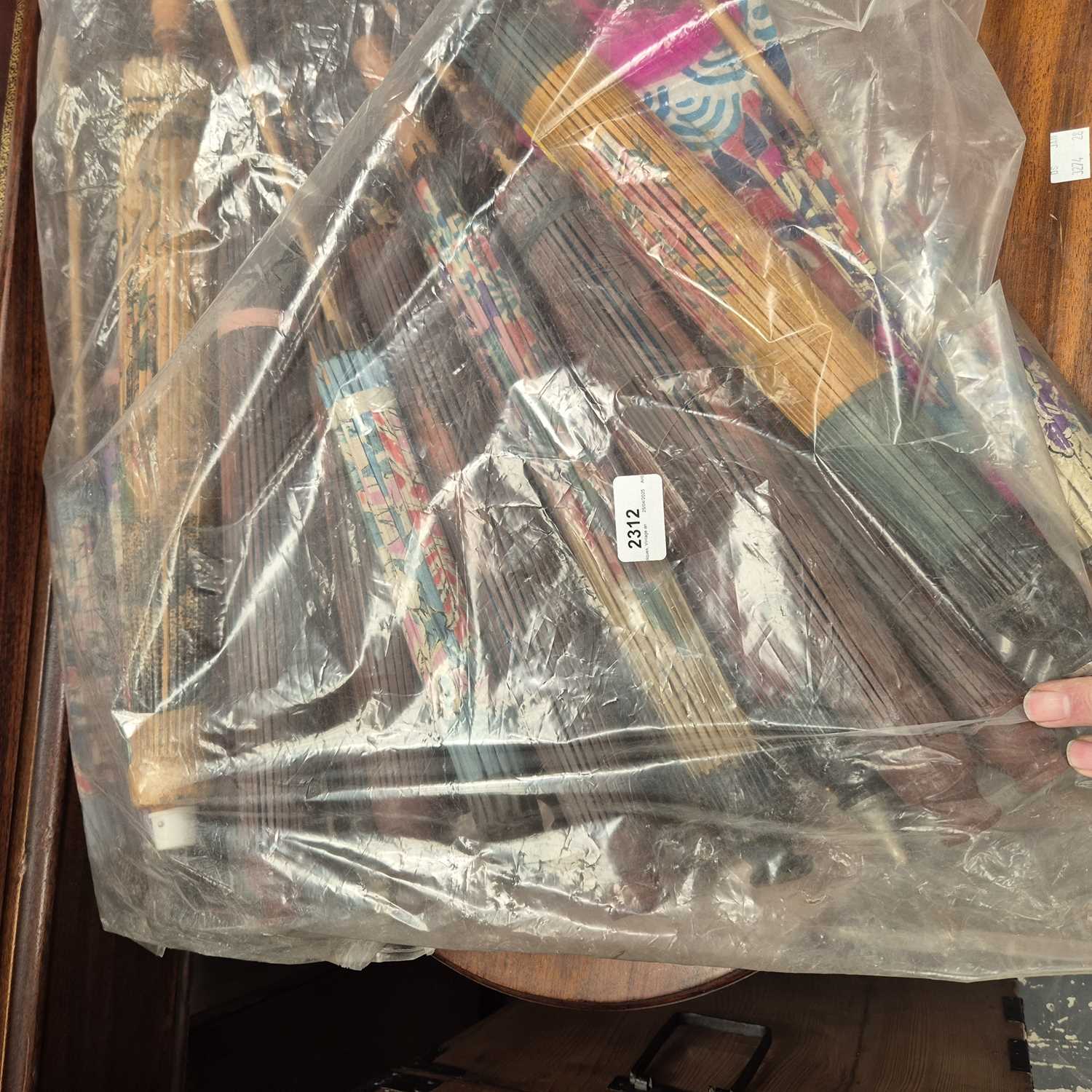 Lot 2312 - A collection of vintage eastern parasols.