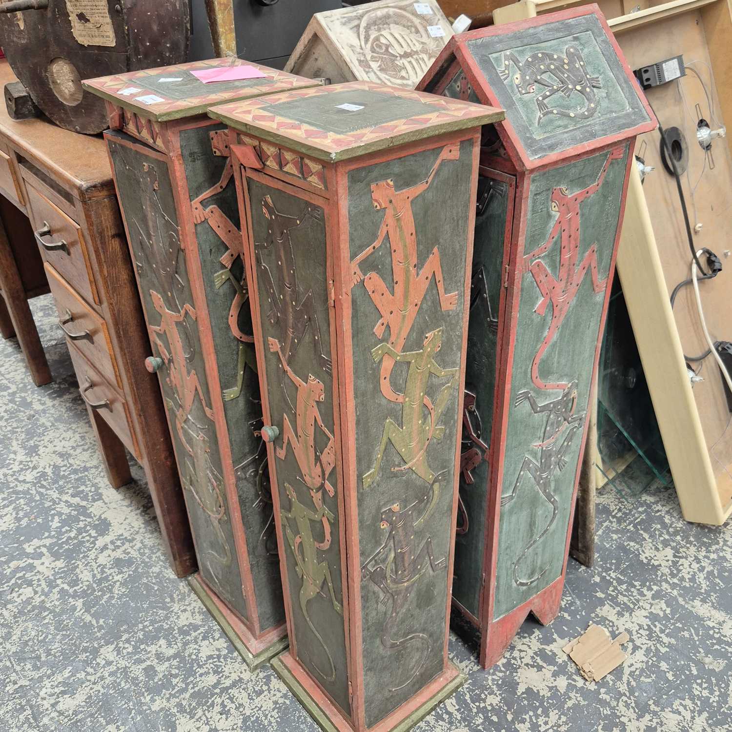 Lot 2339 - Four various, decorated pillar-form cabinets.