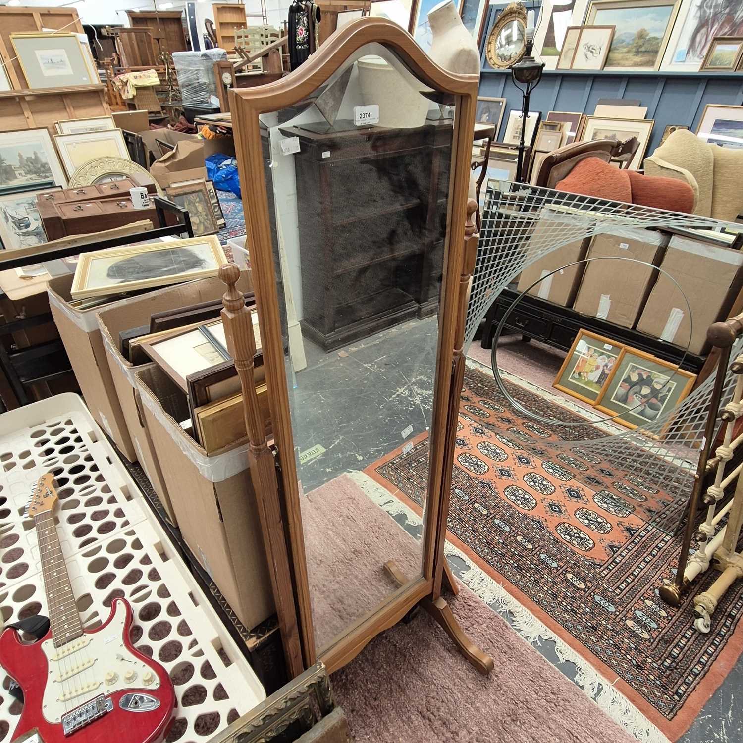Lot 2374 - A pine cheval mirror.