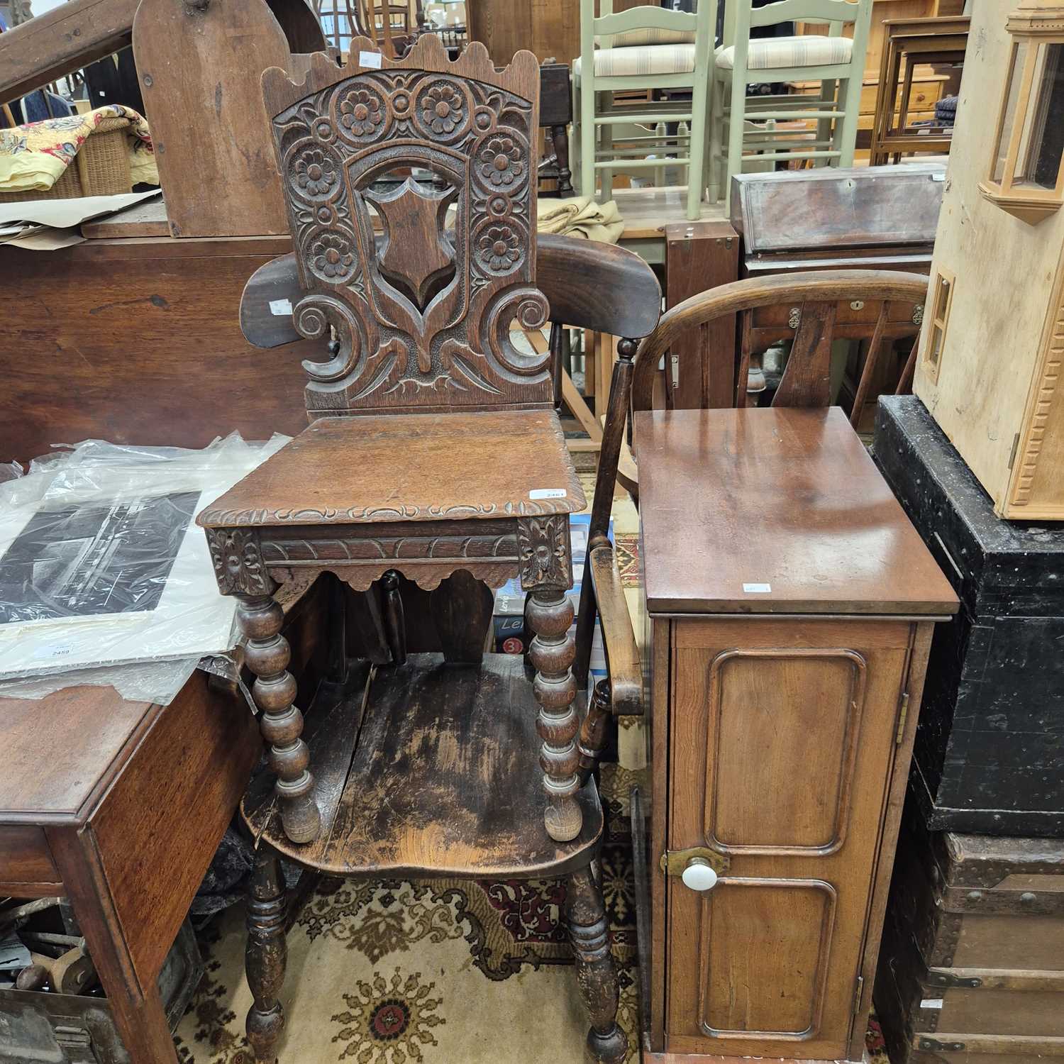 Lot 2461 - A pair of carved oak hall chairs, a mahogany...