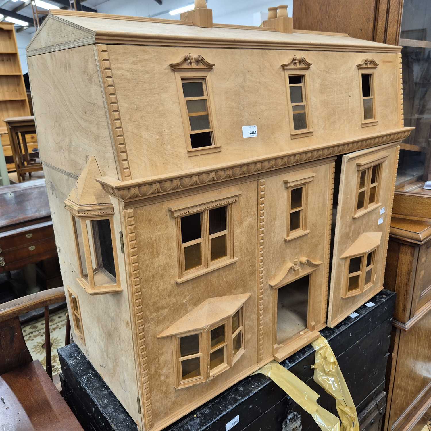 Lot 2462 - A large Georgian-style doll's house.