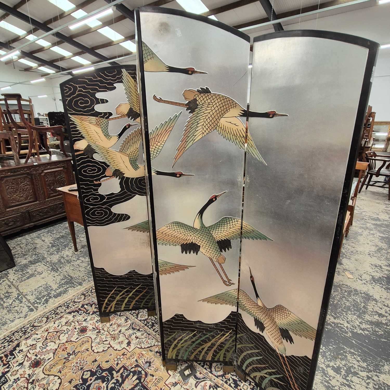 Lot 2548 - An oriental lacquer four fold screen.