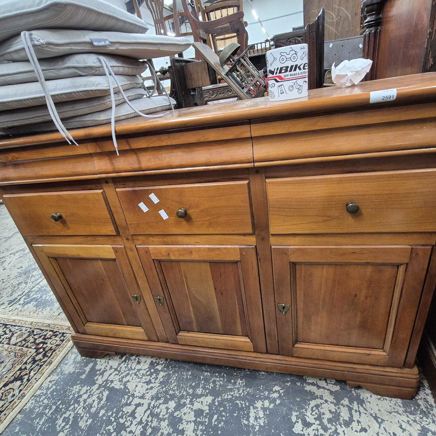 Lot 2591 - A modern cherry wood sideboard.