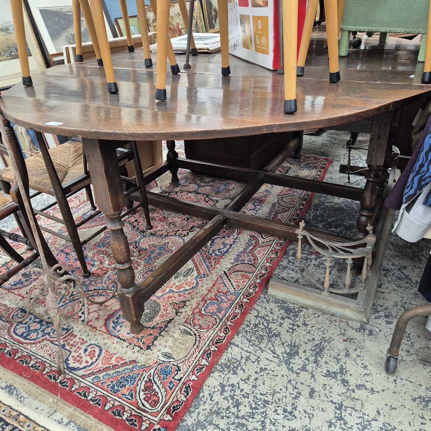 Lot 2595 - A large 18th-century oak drop-leaf gate leg...