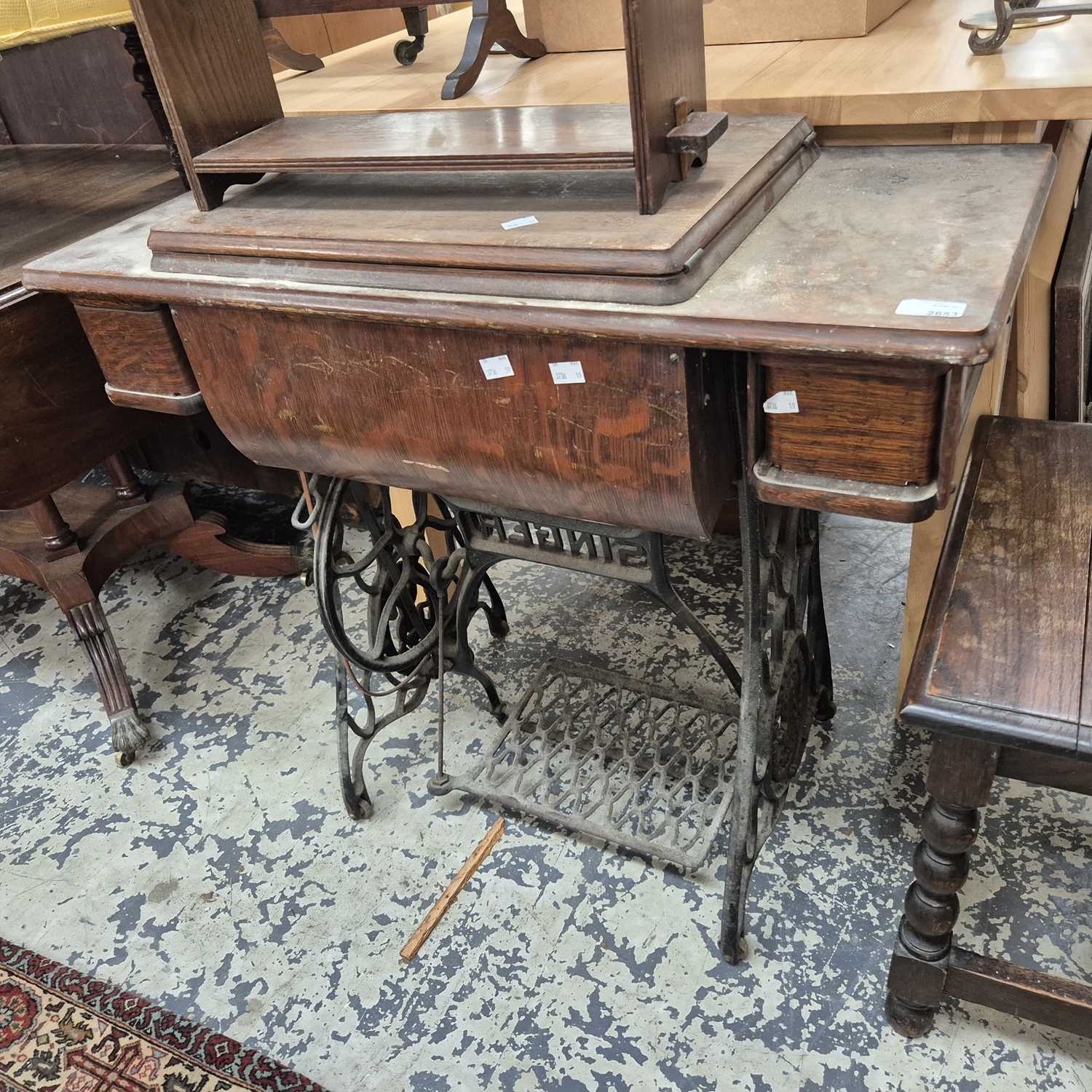 Lot 2653 - A Singer treadle sewing machine.