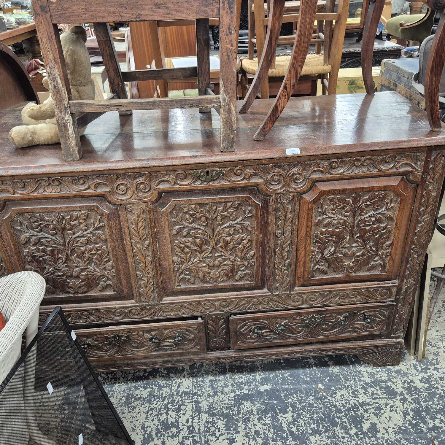 Lot 2664 - An 18th-century carved oak mule chest. 150 x...
