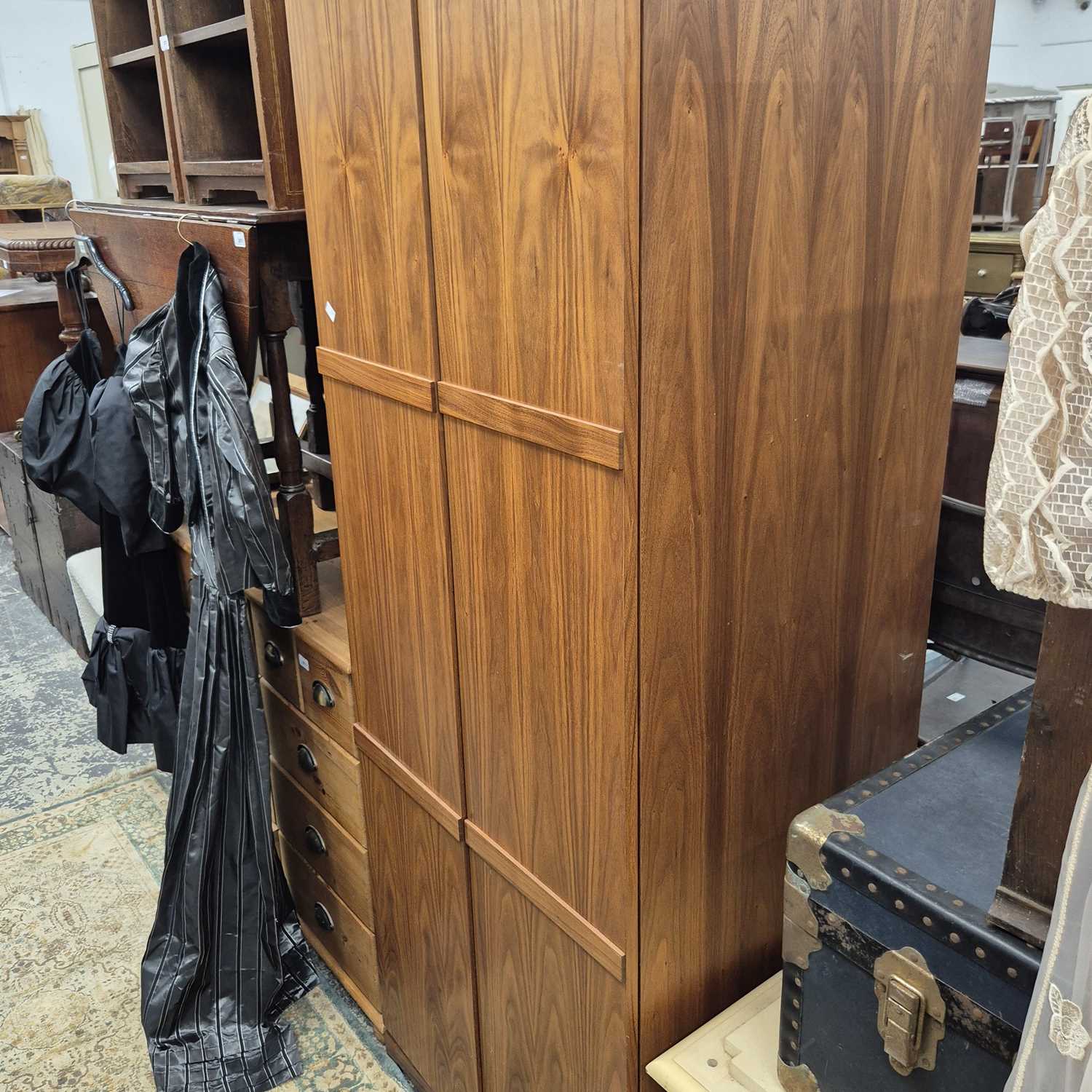 Lot 2670 - A modern walnut two-door wardrobe.