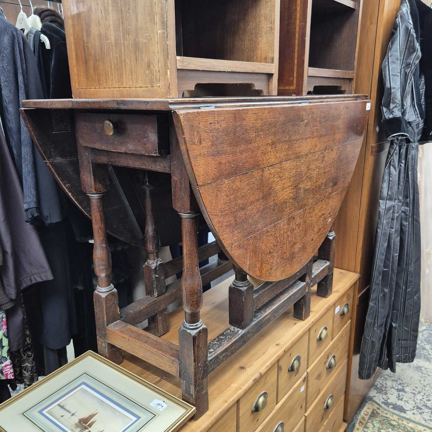 Lot 2671 - A small Georgian gate leg table.