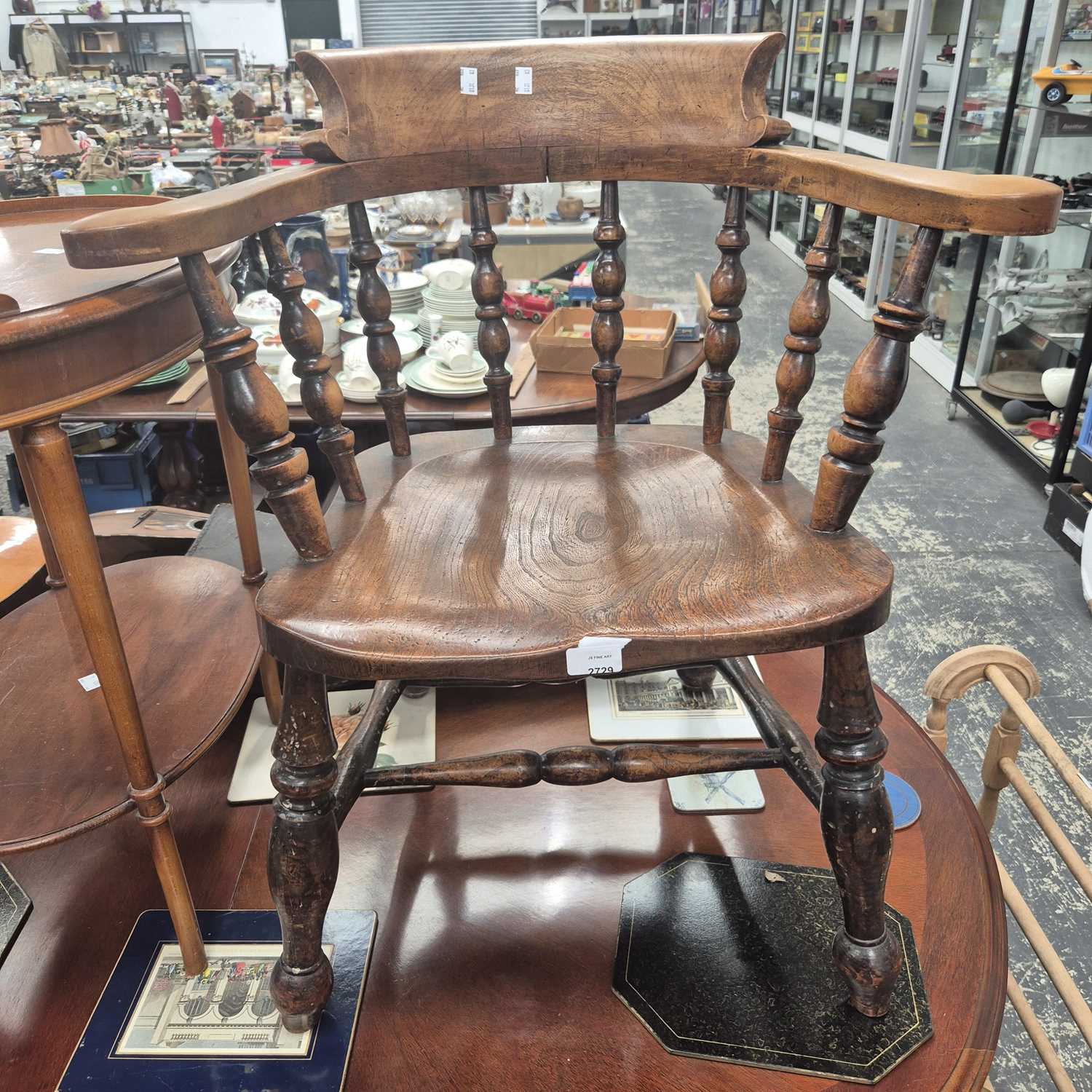 Lot 2729 - An antique captain's chair.