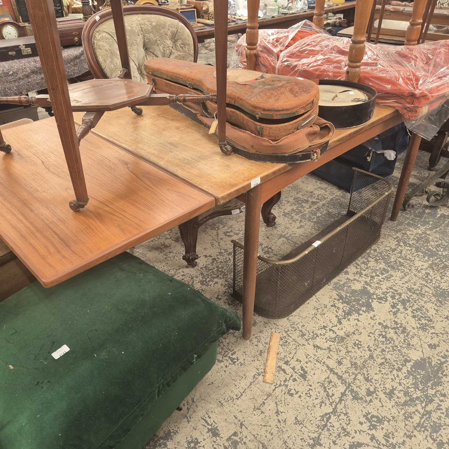 Lot 2744 - A large retro teak dining table.