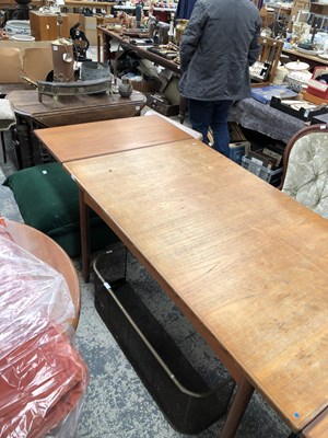 Lot 2744 - A large retro teak dining table.