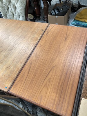 Lot 2744 - A large retro teak dining table.